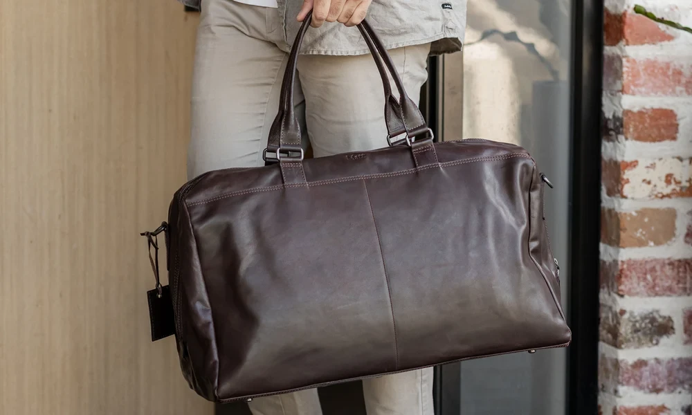 A Bag Held in Hand Has to Fit the Day